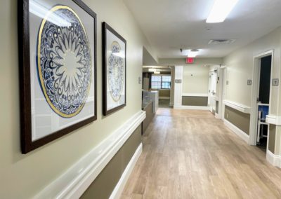 Memory Care Unit hallway outside dining room at Majestic Care of Connersville in Connersville, IN