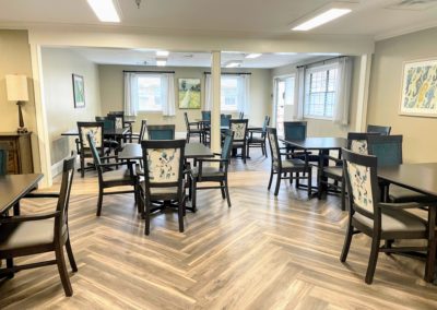Elegant dining room area in senior living Memory Care Unit at Majestic Care of Connersville located in Connersville, IN